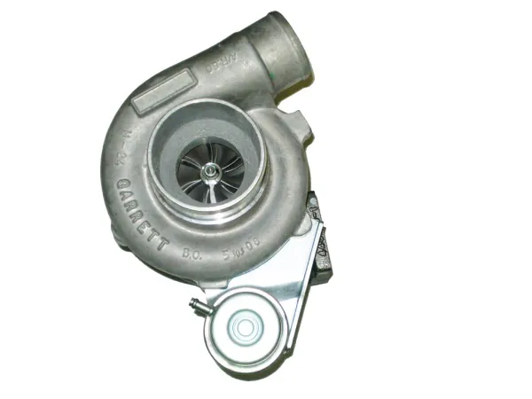 A gray metallic Garrett GT2860R turbocharger, shot at a slight top angle, shows the round compressor housing with the Garrett logo. The compressor wheel’s precision blades are visible inside. A control unit is mounted at the bottom.