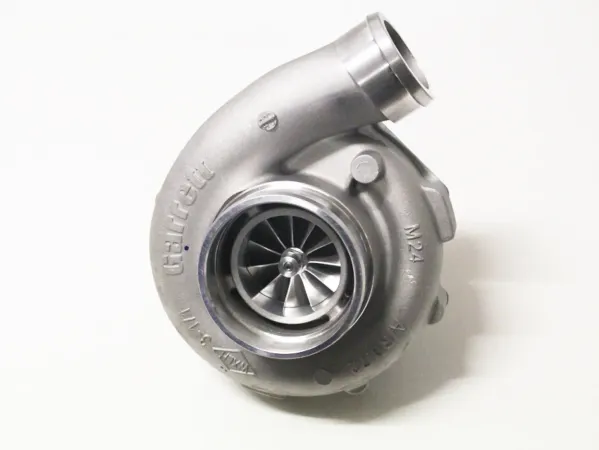 Silver “ Garrett ” GTX3076R GEN II Super Core turbocharger. Shiny metallic compressor housing with embossed “ Garrett ” logo and model markings. Compressor wheel visible; upper inlet for fresh air. Ball-bearing mounted; without exhaust housing.