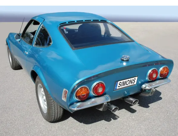 Rear view of a turquoise Opel GT 1900 with duplex sports exhaust system from Simons. The license plate bears the brand name. Two oval tailpipes are visible, embedded in the chrome bumper under the round rear lights.