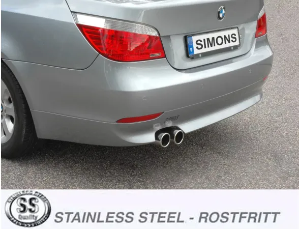 Rear view of a silver BMW 5 Series E60 sedan. Visible are the taillights, the rear bumper, and two round stainless steel tailpipes from the Simons sports exhaust system. The license plate bears the name "Simons".