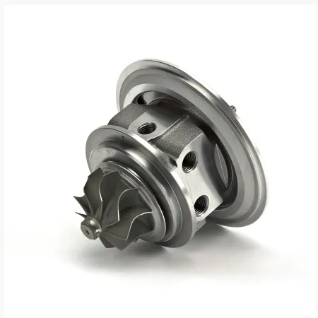 Close-up of a turbocharger upgrade K04-064 Hybrid GEN II made of silver-colored metal. Precisely milled compressor wheel with nine blades, round housing elements with threaded holes. Ball bearing mounted for 2.0 TFSI EA888 engines.