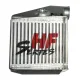 Frontal close-up of a silver-colored HF-Series intercooler, which is made of aluminum and has cooling fins. The series logo is printed on the radiator in red and black. A connection piece is visible at the top.