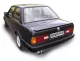 Black BMW E30, rear view, with Simons license plate and duplex sports exhaust system (2x70mm). The exhaust pipes are made of aluminized steel. The vehicle model is 320i/323i/325i.