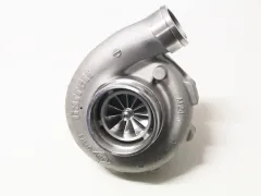 Silver “ Garrett ” GTX3076R GEN II Super Core turbocharger. Shiny metallic compressor housing with embossed “ Garrett ” logo and model markings. Compressor wheel visible; upper inlet for fresh air. Ball-bearing mounted; without exhaust housing.